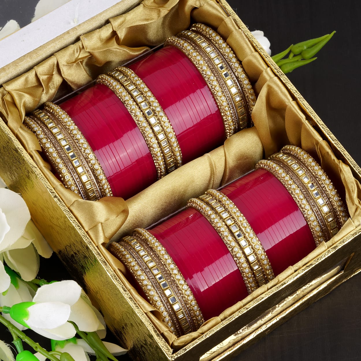 Detailed AD stone design on red bridal bangles