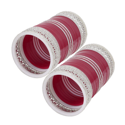 Closeup of bridal chura red with silver work